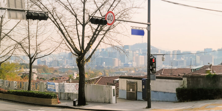 Autumnal street view of Jongno with a cityscape in the background, in Seoul, Korea, in a peaceful and serene atmosphere