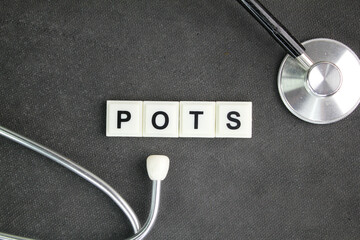 stethoscope and the letters POTS or the word Postural Orthostatic Tachycardia Syndrome. symptoms...