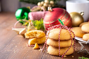 Stack of shortbread sugar cookies with Christmas decorations