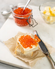 Sandwich with butter and red salmon caviar