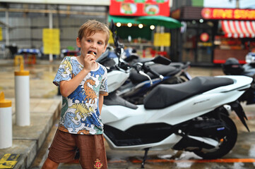 Little boy with ice cream. Thailand