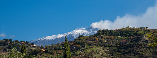 Mount Etna snow-capped peak view from Bronte countryside, Sicily