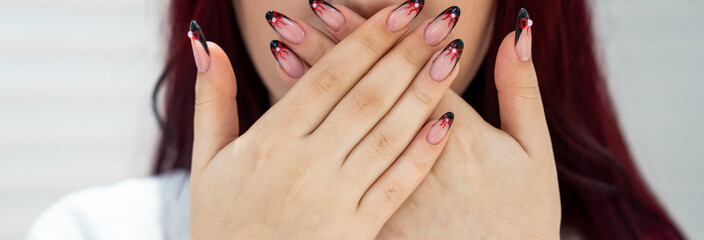 the girl covered her mouth with both hands, silence