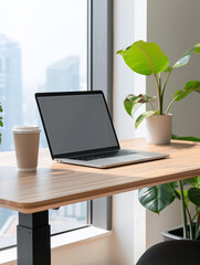 Fototapeta premium Remote workspace with minimalist desk with a laptop, books, and plants, and a view of the city skyline through a large window
