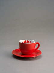 Still life of a coffee cup, on a grey background