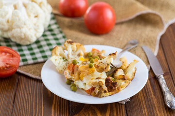 fried omelette with cauliflower and vegetables in a plate