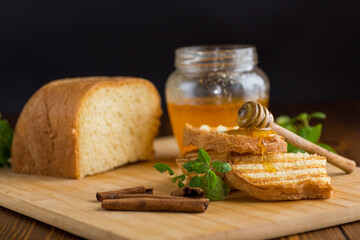 bread fried sweet toasts with honey on wooden board with cinnamon