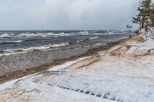 Footpath between winter Baltic Sea s dunes in Saulkrasti in Latvia - Powered by Adobe