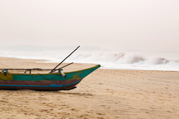 Naklejka premium Colorful beautiful boat moored on the beach