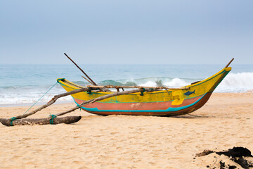 Obraz premium Colorful boat moored near the Ocean