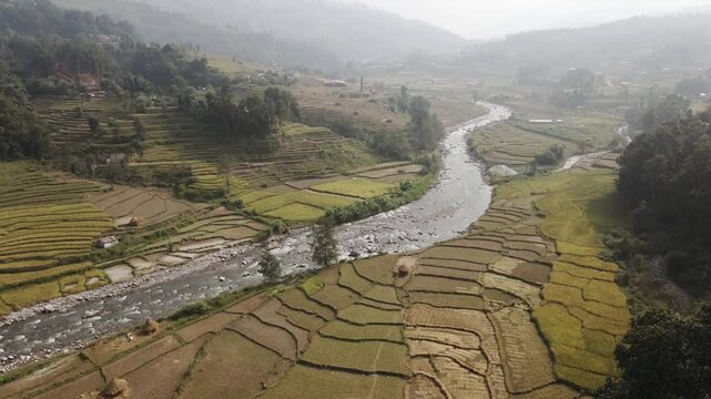 aerial view of river and paddy farmland in Nuwakot, Nepal.