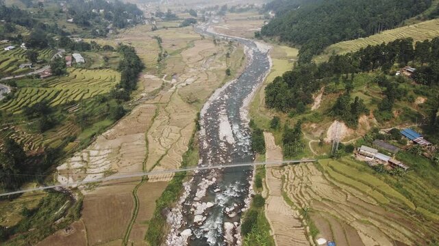 aerial view of river and paddy farmland in Nuwakot, Nepal.