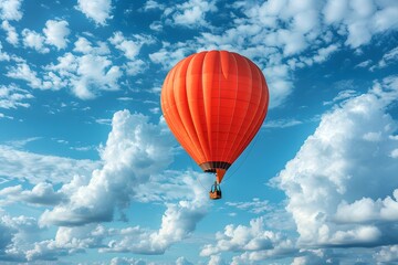 Obraz premium Vibrant Hot Air Balloon Soaring Through a Cloudy Blue Sky for Adventure and Travel Themes