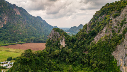 Fototapeta premium Aerial of Ban Chai Khao limestone mountains in Thailand Uthai Thani province , drone fly above famous Thai-Switzerland 
