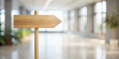 A sleek minimalist wooden direction sign rests atop a white background, embodying modern architectural design while offering a stylish, functional accent for any space.