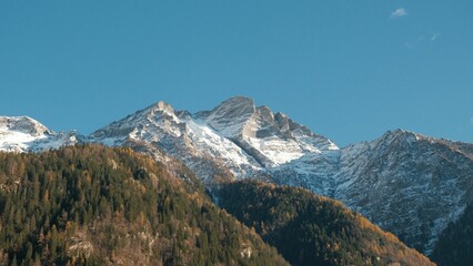 Snow-capped mountains under a clear blue sky