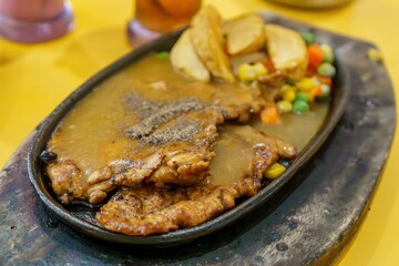 Mouthwatering paper chicken paired with crispy fries and fragrant herbs. The perfect comfort food!