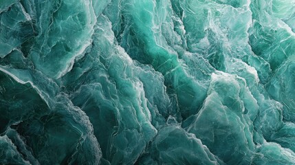 Obraz premium A stunning turquoise sea surface with dynamic waves reflecting light and creating an alluring pattern.