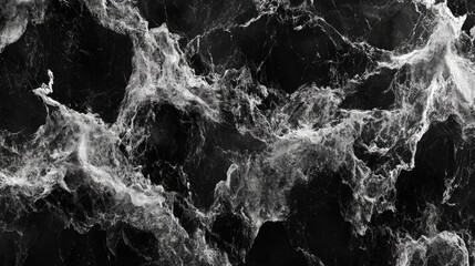Naklejka premium Abstract black marble texture with swirling white and gray veins.