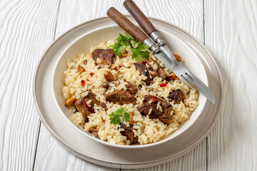 beef and rice in white bowl, top view