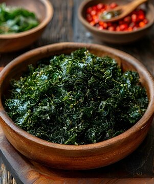 plate with seaweed salad, green tea in a bowl