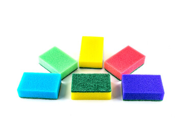 Colorful sponges for washing dishes on a white background