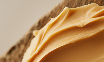 Rich and Creamy Butter Spread on Rustic Bread: Exploring Texture and Flavor in Culinary Delights