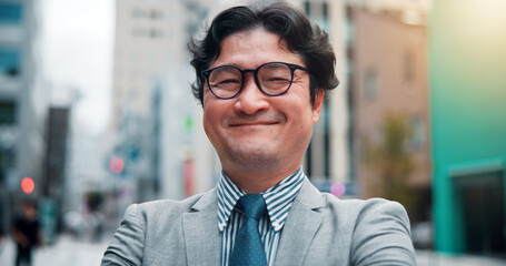 Business, happy and portrait of Asian man in city for morning commute, travel and journey. Professional, corporate worker and person with confidence, pride and smile for career, job and work in Japan