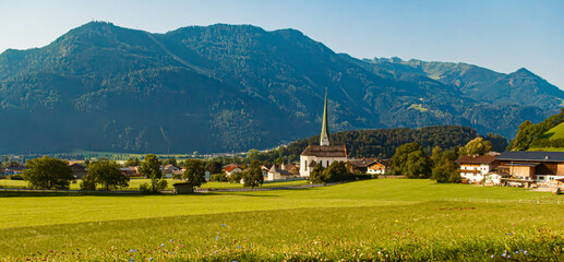 Alpine summer view with a church at Wiesing, Schwaz, Tyrol, Austria