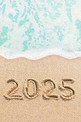 Numbers 2025 written on the beach. Happy new year and holidays travel concept photo