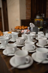 Elegant Holiday Coffee Table with Stylish Cups and Festive Atmosphere