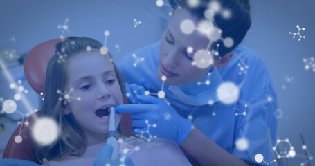Naklejka premium Image of molecules over caucasian male and female dentists and girl patient