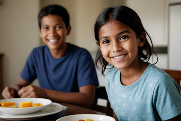 Happy latin american children eating healthy breakfast at home