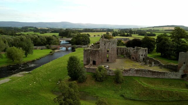 The Eamont river and the Brougham Castle on the background, United Kingdom. Aerial footage.