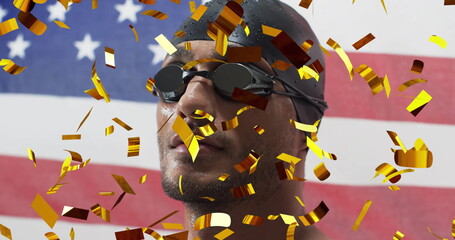 Image of confetti falling over biracial male swimmer and flag of usa