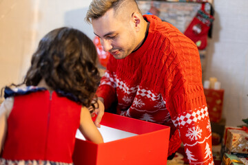 Happy father and little girl daughter celebration surprise christmas gifts box. Christmas and holidays concepts. family, christmas, x-mas.