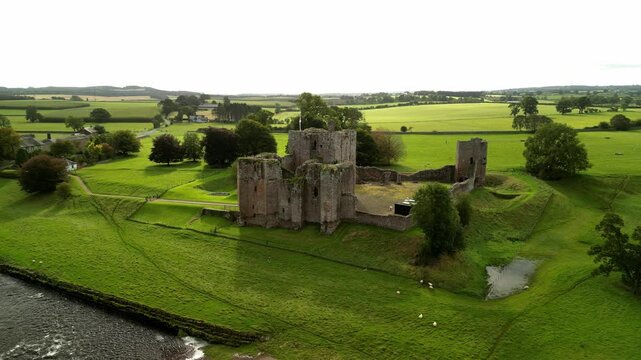 Ruins of the Brougham Castle and rural landscape, United Kingdom. Aerial footage.