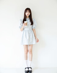Young Woman in dress with coffee cup white Background
