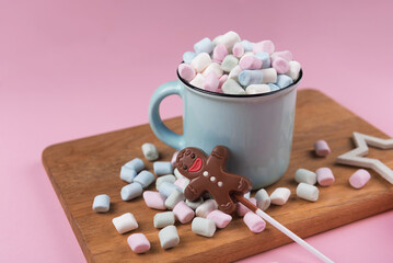 Marshmallow cup with chocolate man, sweet Christmas cookies