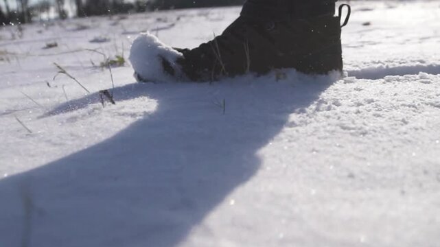 feet walking in deep snow shot in slow motion