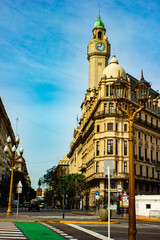 Naklejka premium Street with historical buildings, road cross, cars, people in city Buenos-Aires, Argentina