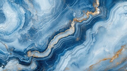 Fototapeta premium Abstract blue and gold marble texture with swirling patterns and shimmering details.