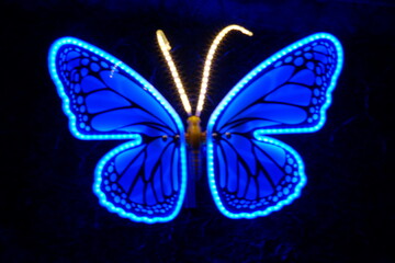 A beautifully illuminated butterfly sculpture featuring vibrant colors, perfect for adding charm to any indoor or outdoor space.