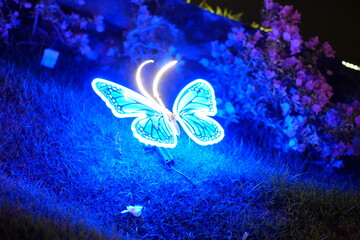 A beautifully illuminated butterfly sculpture featuring vibrant colors, perfect for adding charm to any indoor or outdoor space.