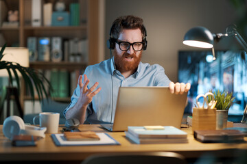 Angry businessman shouting at his laptop © StockPhotoPro