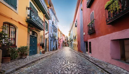 Charming narrow cobblestone alley lined with colorful buildings inviting exploration and adventure