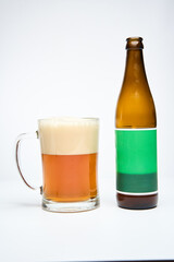 Beer in a glass mug on white