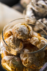 Chocolate marble cookies with cracks.Marble cookies in a glass jar in a coffee shop. Marble cookies close-up.