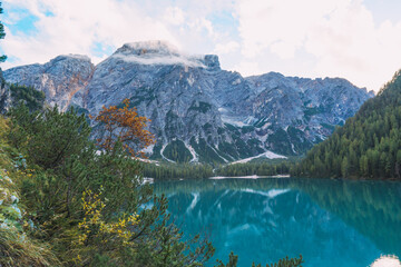 A beautiful mountain lake lago di braies with a blue sky in the background