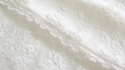 Obraz premium Delicate white lace fabric with floral embroidery.